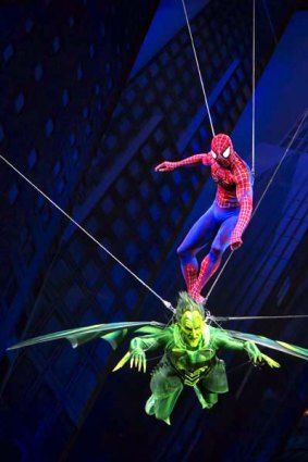 Spider-Man rides on the Green Goblin during a fight sequence during the musical 'Spider-Man: Turn Off the Dark'