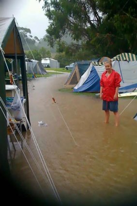 Stephanie Smith at her flooded campsite in Wye River.