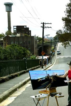 Not going to be a water feature for long: Sydney Ports' artist-in-residence Jane Bennett paints the MSB Tower.