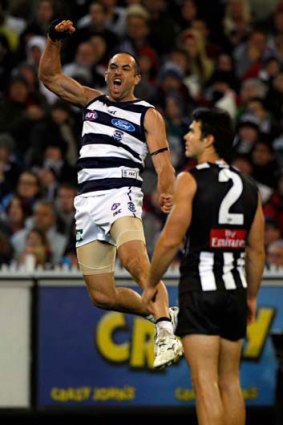 Redemption ... Geelong’s James Podsiadly, left, celebrates.