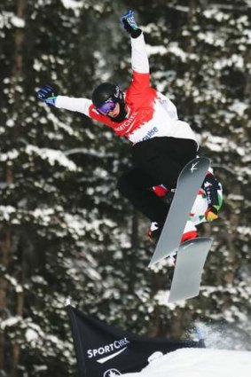Jarryd Hughes competes in the men's World Cup snowboard cross event in Lake Louise in December 2013.