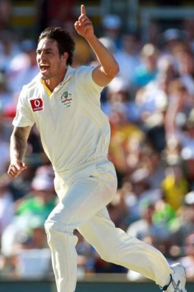 On fire &#8230; Mitchell Johnson celebrates taking the wicket of Andrew Strauss in Perth last year.