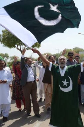 Scenes of jubilation: Supporters of Pakistan's former military ruler Pervez Musharraf gather at the airport.