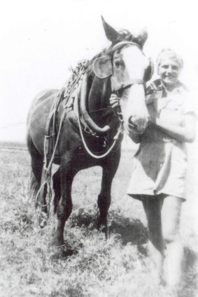 Peggy Williams on the farm in WWII.