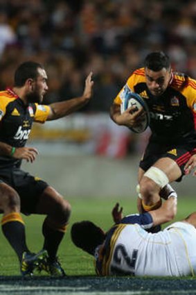 Coming through: Liam Messam of the Chiefs charges with the ball against the Brumbies in the Super Rugby final.