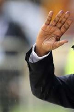 Lukewarm reception ... South African President Jacob Zuma waves as he arrives at FNB Stadium.