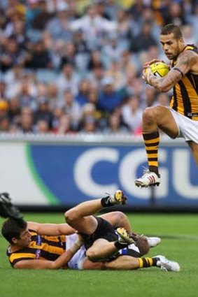 Lance Franklin leaps over teammate Ben Stratton and Magpie Heath Shaw before letting fly the powerful kick (pic above) that went through for a goal.