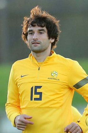 Mile Jedinak of the Socceroos run during an Australian Socceroos training session at Lakeside Stadium.