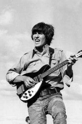 George Harrison in 1966 with a Rickenbacker.