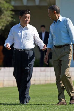 President Barack Obama and Chinese President Xi Jinping walk at the Annenberg Retreat of the Sunnylands estate Saturday, June 8, 2013, in Rancho Mirage, California.
