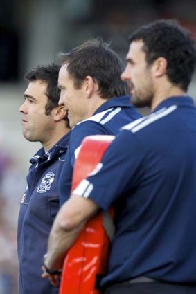 Cats senior coach Chris Scott (left) with assistants Brenton Sanderson and Nigel Lappin, 27 August 2011.
