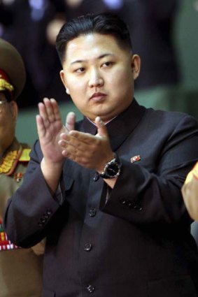 Kim Jong-un applauds the performance.