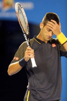 Feeling the burn ... Novak Djokovic during Sunday night's five-set test.