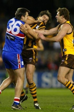 A brusing encounter with Hawk opponent Nathan Thompson in 2004