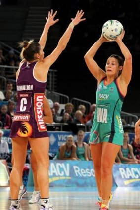Madi Robinson (right) looks to pass under pressure for the Vixens.