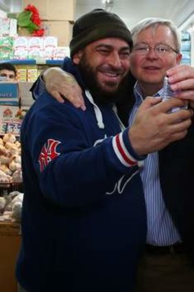 One more for good luck: Kevin Rudd socialises at the Flemington Fruit Market.