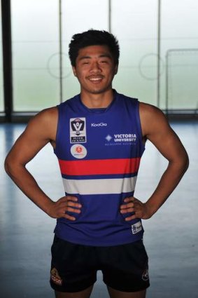 Bulldogs player Lin Jong models the new Footscray VFL jumper.