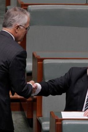 Former Speaker Harry Jenkins is congratulated by Malcolm Turnbull.
