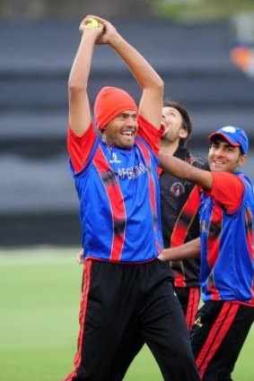 All smiles: The Afghanistan cricket team trains at Manuka Oval on Thursday.