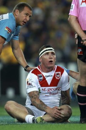 Josh Miller of the Dragons after being hit in a high tackle against the Eels in 2012.