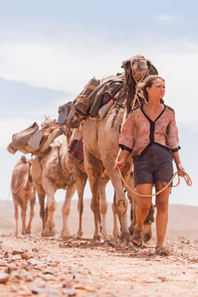 Mia Wasikowska plays Robyn Davidson, who makes epic camel trek across the Western Australian outback in <i>Tracks</i>.