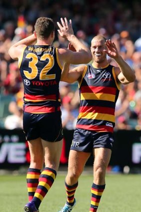 Scoot Thompson and Patrick Dangerfield celebrate.