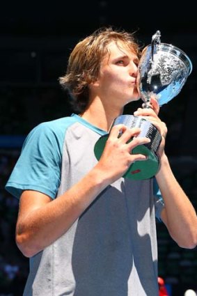 Alexander Zverev of Germany poses with his trophy.