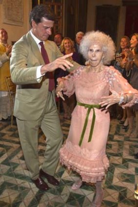 A bride on the move ... the Duchess of Alba dances with her son, Cayetano Martinez de Irujo, during the wedding celebrations in Seville.