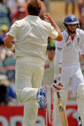 Australian bowler Ryan Harris celebrates bowling England's James Anderson for 3 runs on day four of the third Ashes Test at the WACA.