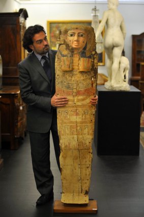 Paul Sumner with the prized Egyptian sarcophagus, along with other eclectic gems  from the collection of the late  Dr Harley Baxter.