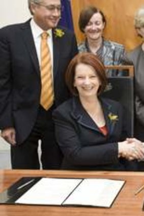 The Greens sign a deal in support of the Australian Labor Party in Julia Gillard's office at Parliament House.