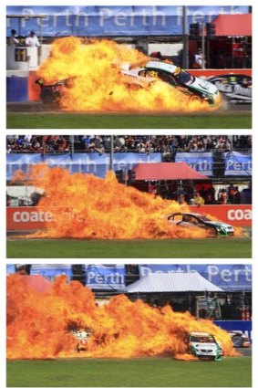 Hot, hot, hot ... Karl Reindler's V8 bursts into flames after being hit by another car.