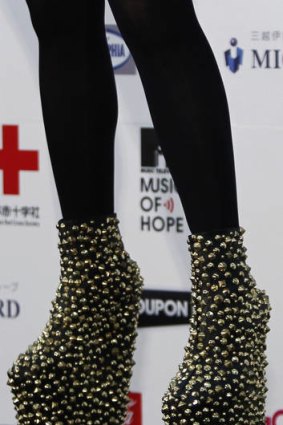 Lady Gaga's shoes are seen as she poses after performing at the MTV Video Music Aid Japan in Chiba.