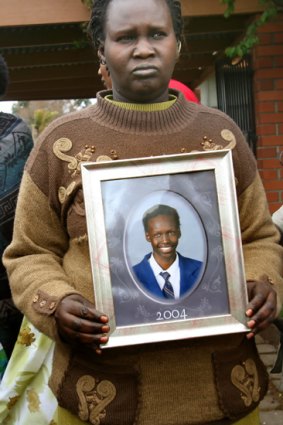 Martha Ojulo holds a photo of her son, Liep Gony.