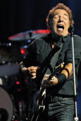 Bruce Springsteen, left, performs with Steven Van Zandt.