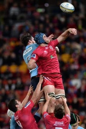 Aerial battle: The Waratahs' Kane Douglas and James Horwill of the Reds contest a lineout during Saturday night's game.