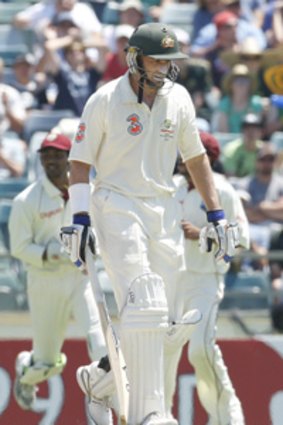 Mike Hussey trudges off after being dismissed for 82.