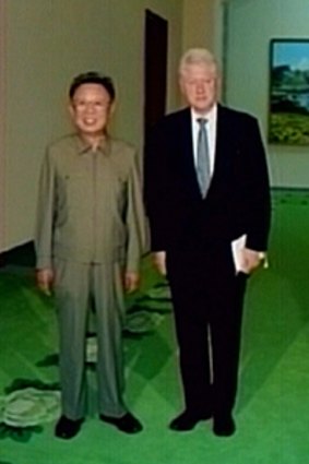 Unlikely pair ... video still shows Bill Clinton with Kim Jong-il in Pyongyang.