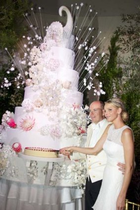 Prince Albert II of Monaco and Princess Charlene cut their wedding cake.
