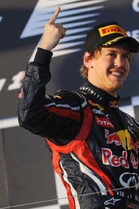 Sebastian Vettel stands on the podium after winning the Australian Formula One Grand Prix.
