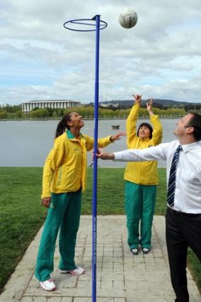 Diamonds player Chanel Gomes, left, coach Lisa Alexander and ACT sports miniter Andrew Barr yesterday in Canberra.