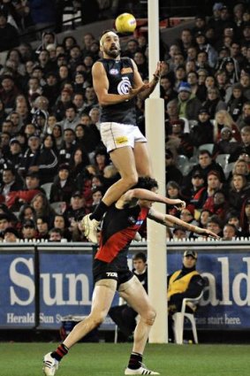 High ho: Andrew Walker takes a spectacular mark.
