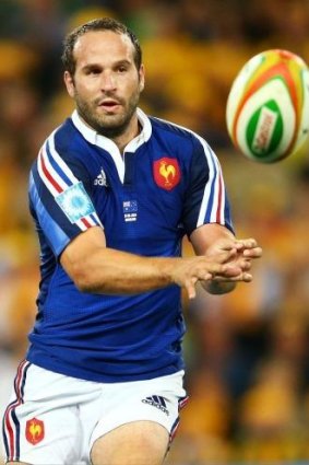 French five-eighth Frederic Michalak spins the ball wide against the Wallabies.