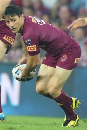 Cooper Cronk passes during game one of the 2014 State of Origin series.