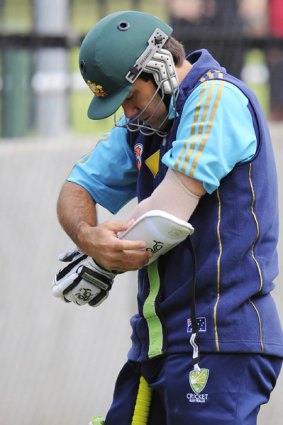 Australian captain Ricky Ponting straps on a guard over his injured elbow yesterday.