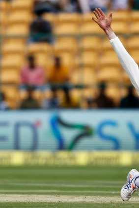 Strike weapon: Nathan Lyon appeals successfully for the wicket of India's captain Virt Kohli in Bangalore back in March.