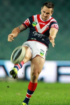 Blinder: Mitchell Pearce kicks for the Roosters.