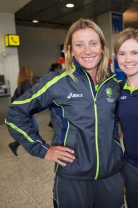Coach Cathryn Fitzpatrick with Jess Cameron after the Australian women's team won the world T20 title in 2012.