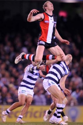 St Kilda's Ben McEvoy rides Geelong's Trent West at the centre bounce.