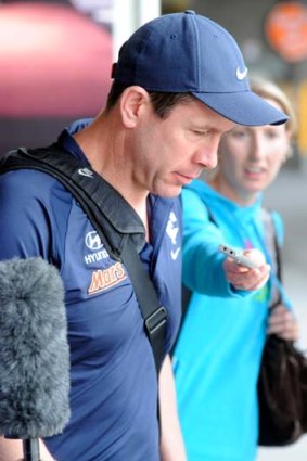 Tough times: Carlton coach Brett Ratten arrives back in Melbourne after the loss to Gold Coast Suns.